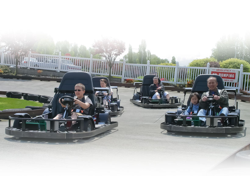 People driving go kart in a track